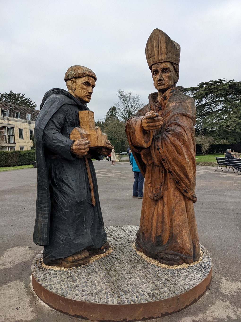 Wooden carvings of an Abbott and a Canon in Cirencester.