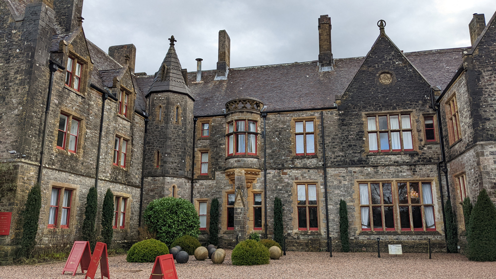 A large country house with gravelled drive and turrets