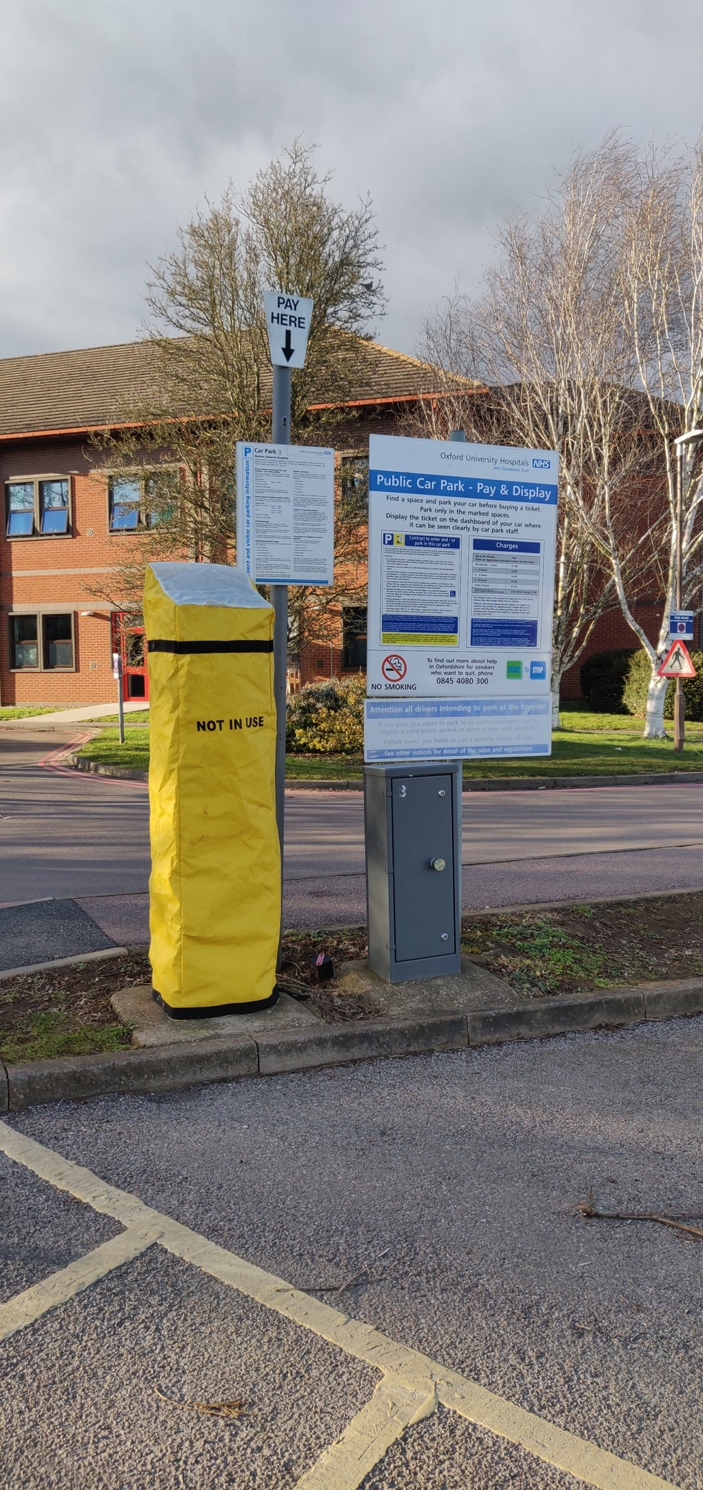 Photo of a parking meter with a yellow 