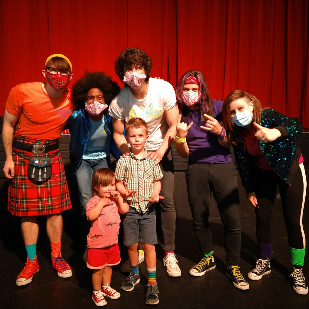 Children with band members in masks