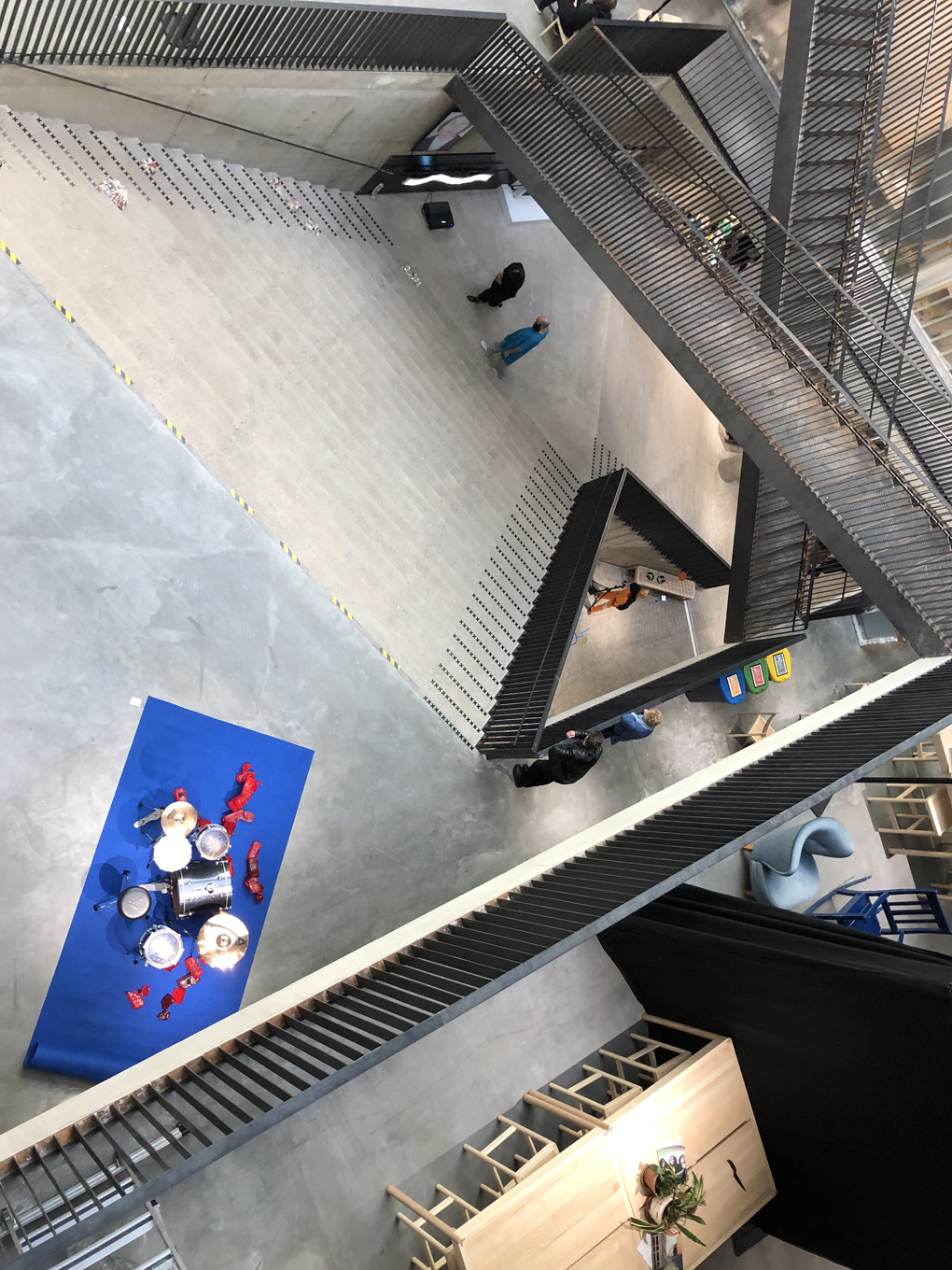 Metal staircases crossing in an entrance hall.