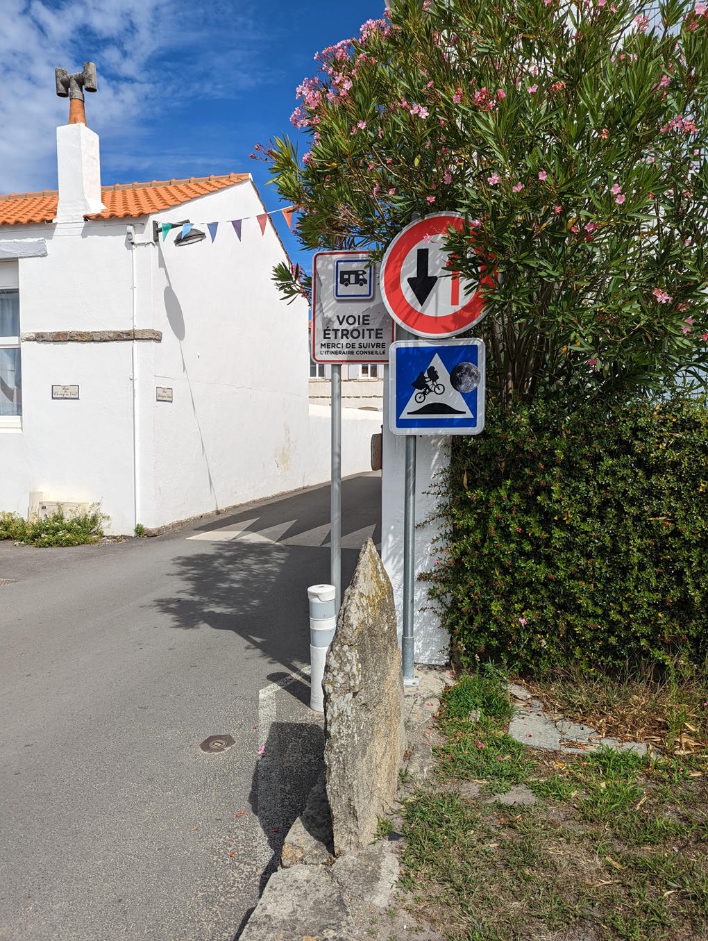 Road speed bump sign decorated with iconic ET silhouette