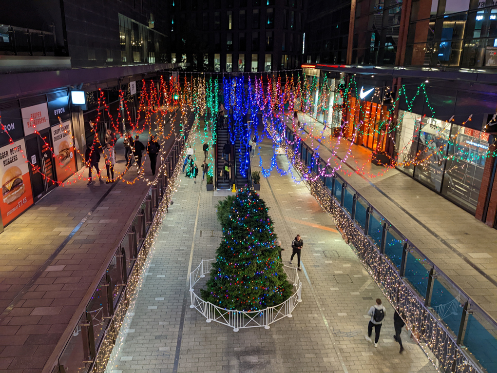 Looking down at a Christmas tree and lights in wembley shopping centre