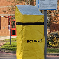 Photo of a parking meter with a yellow 