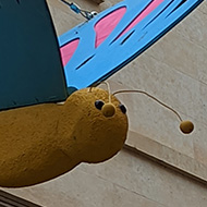 Large model butterflies hanging in a street in Bath