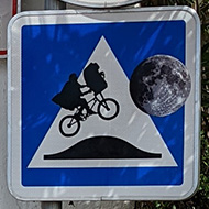 Road speed bump sign decorated with iconic ET silhouette