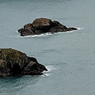 Heavy sky over a blue sea on the Pembrokeshire coast