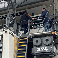We see the front of a giant mining truch at the Bauma Construction and Mining Trade Fair Munich