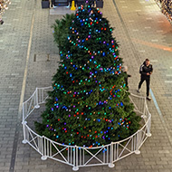 Looking down at a Christmas tree and lights in wembley shopping centre