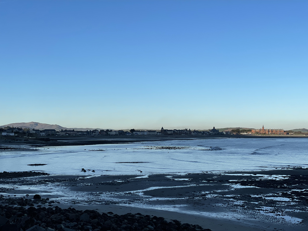 Seaside view at sunset with the Mourne Mountains in the background