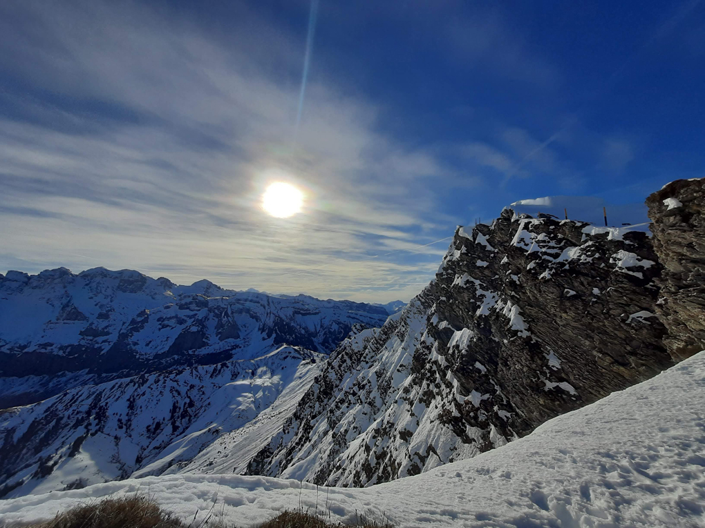 Snow capped mountains against a brilliant blue sky