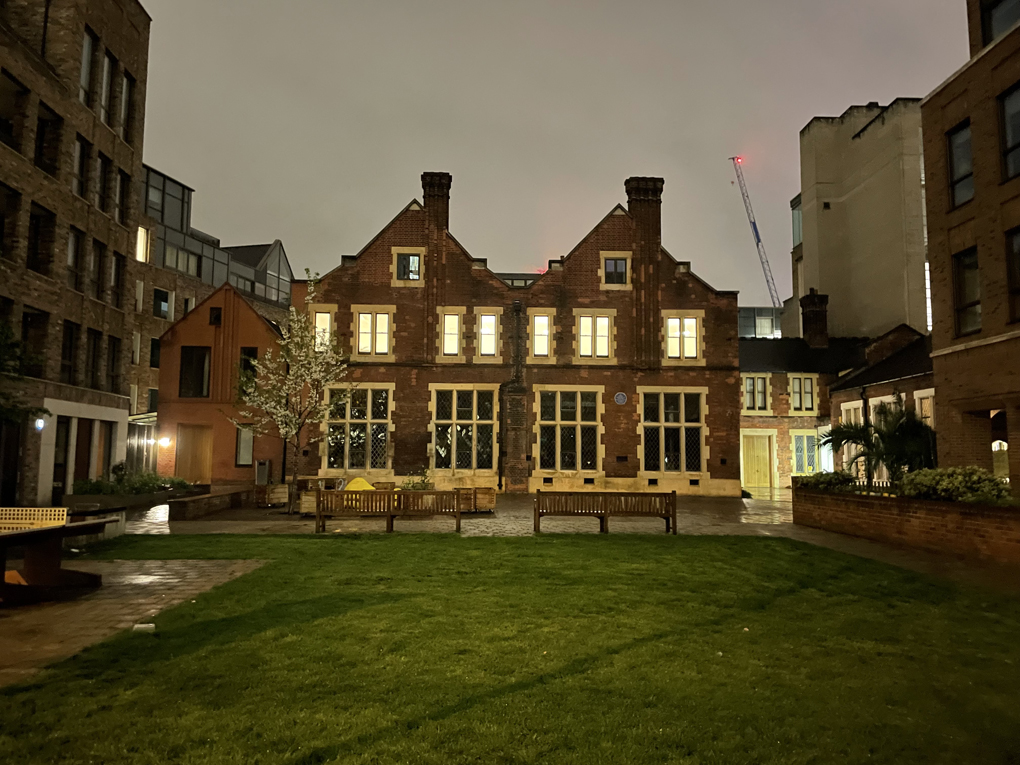 Almshouses as night in the city of London lit fro