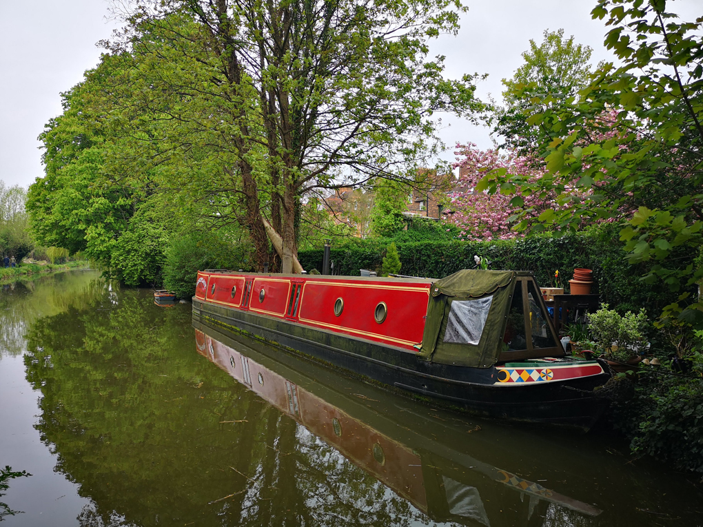 Canal boat on Oxford canal with trees.