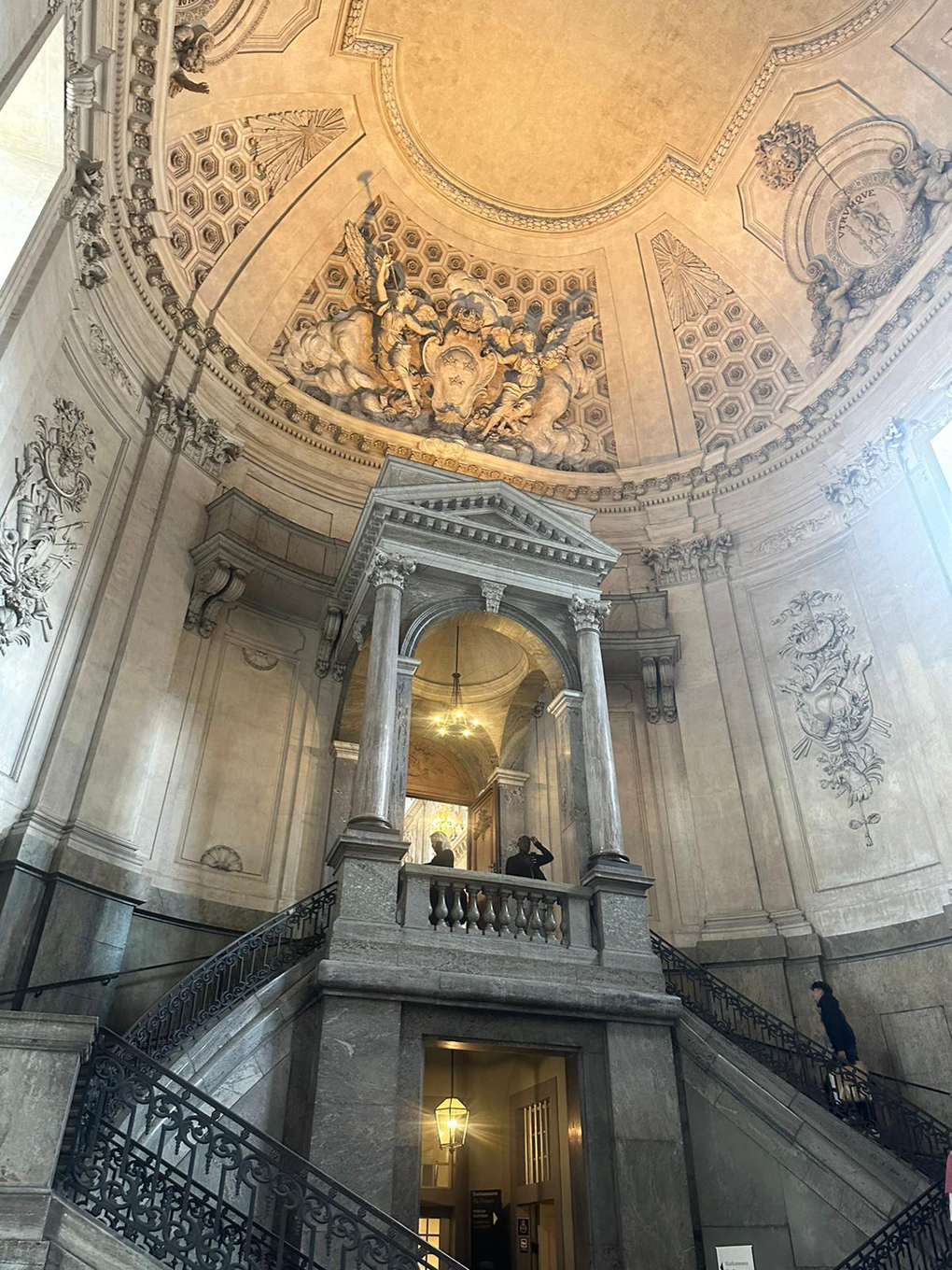 Elegant stone architecture, steps statues and a dome