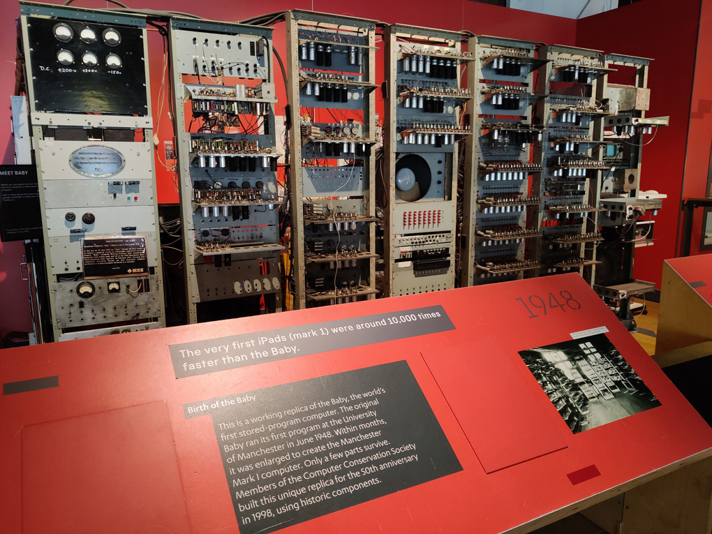 Multiple tall cabinets with racks of vacuum tubes, dials, switches and what might be an oscilloscope display make up a replica of the 1948 computer Baby, originally built by Manchester University and the precursor to the Manchester Mark 1