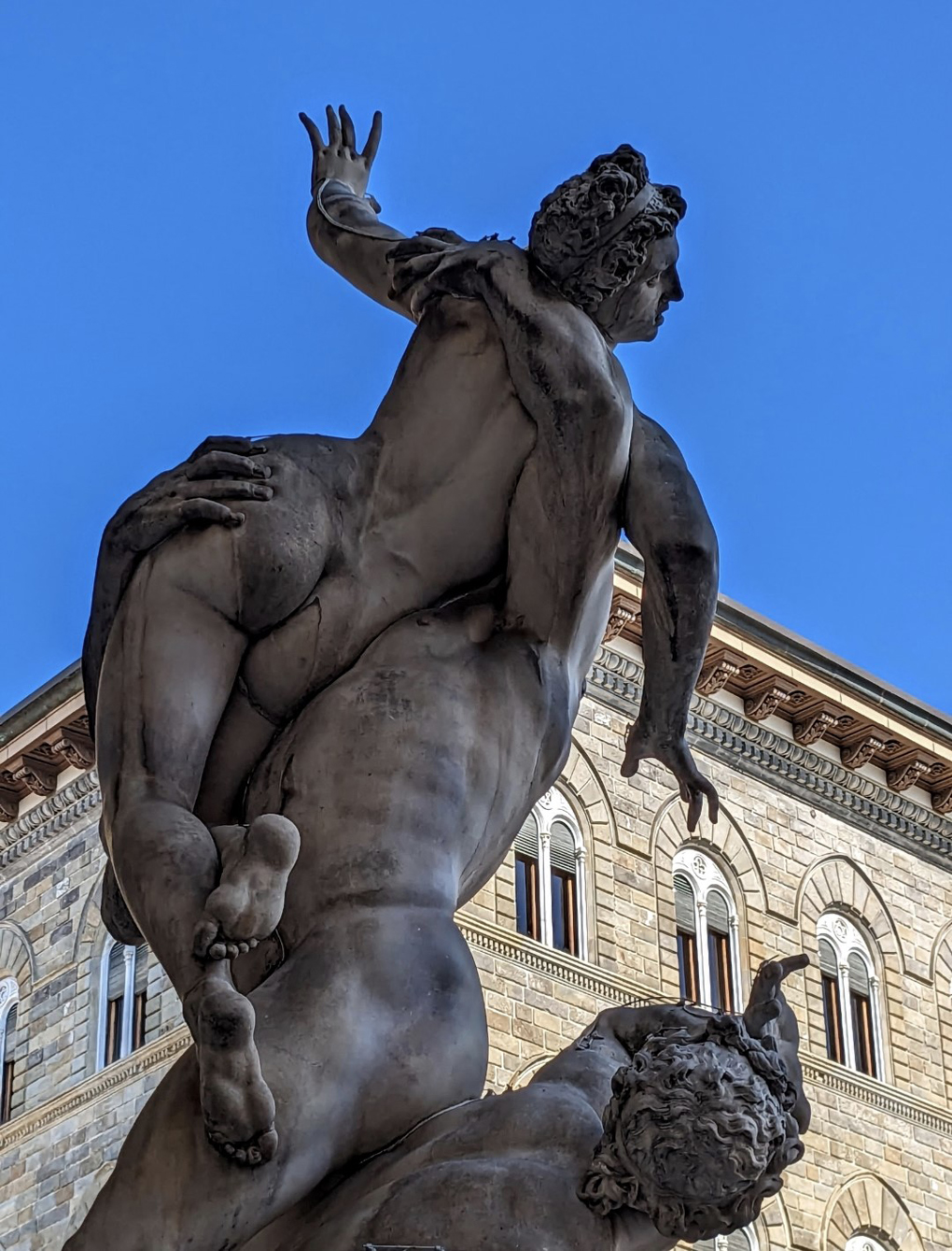Statue of woman held aloft Florence, Italy