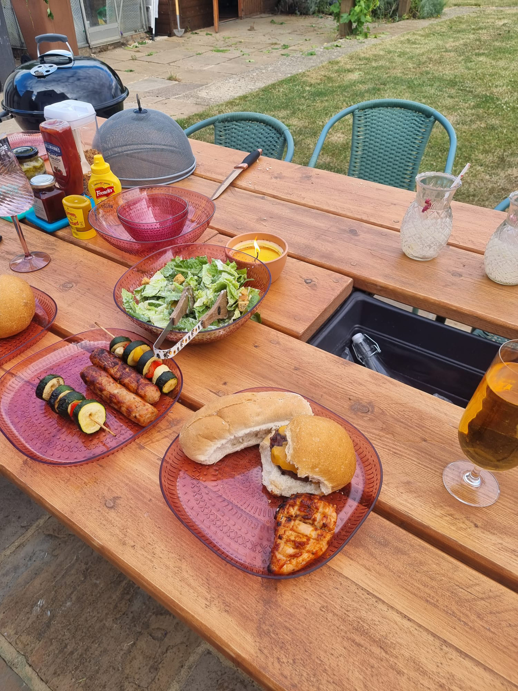 BBQ food spread over an outside table