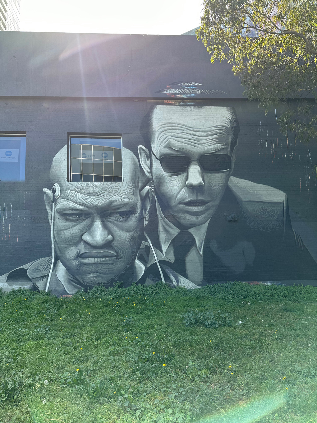 Street art mural depicting Morpheus and Agent Smith in The Matrix during the interrogation scene