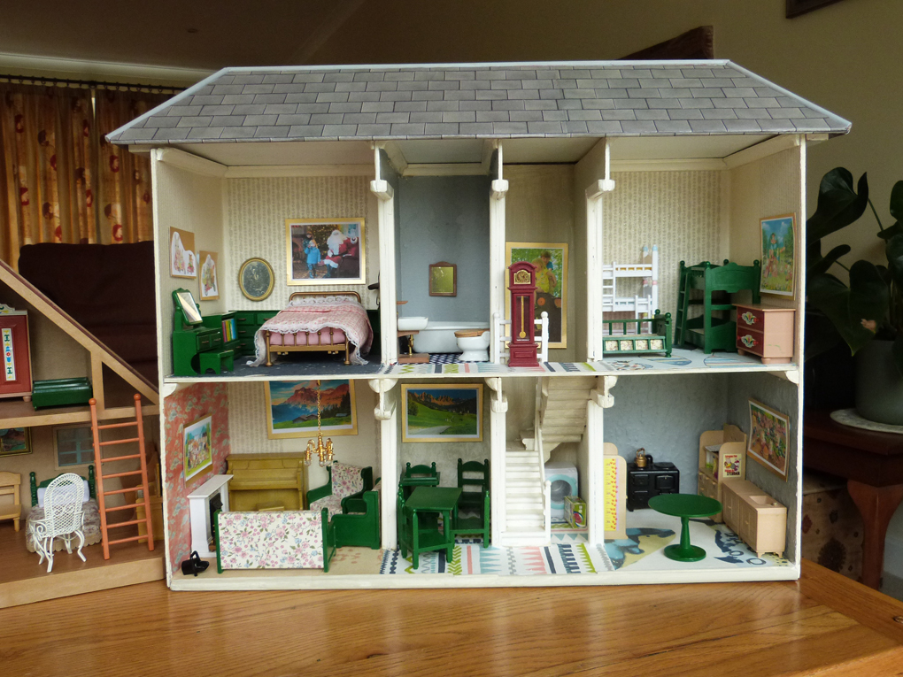 I originally built a doll's house for our daughter about 35 years ago, and redecorated every room in the house, plus a new roof (which is quite a claim) earlier this month for our granddaughter. Talk about upcycling!