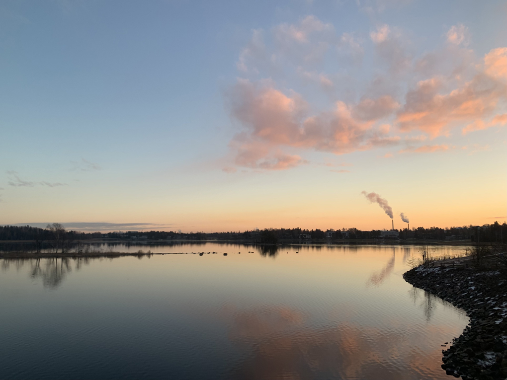 Faint sunrise over water.