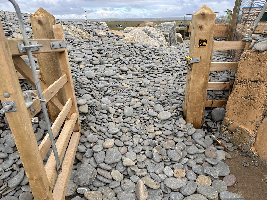 A public footpath blocked by rocks and boulders