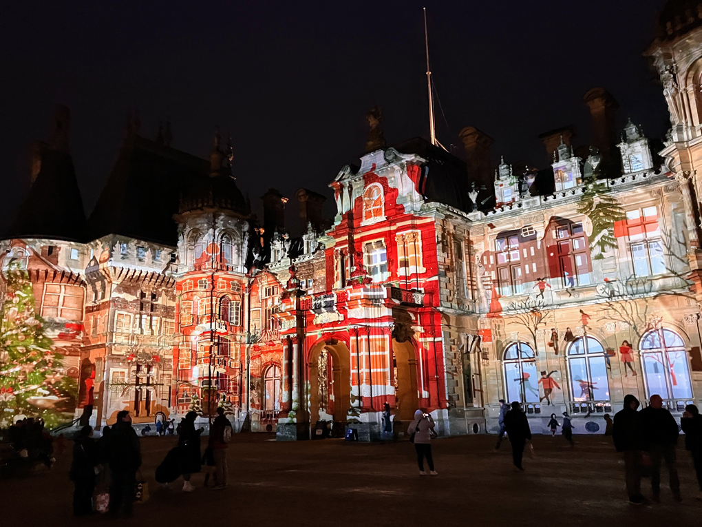 Waddesdon Manor being projected on with a colourful advent calendar.
