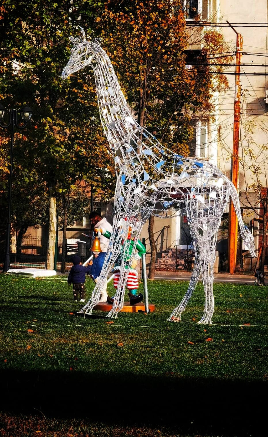 Christmas illuminated giraffe in park