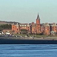 Seaside view at sunset with the Mourne Mountains in the background