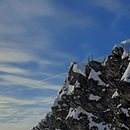 Snow capped mountains against a brilliant blue sky