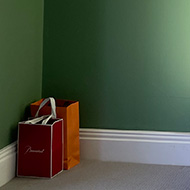 Image of plain green wall with sunlight shining on it