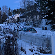 Snowy road and houses.