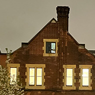 Almshouses as night in the city of London lit fro