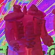 Rock band The Flaming Lips on-stage accompanied by four 20ft tall inflatable robots.