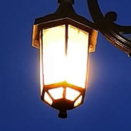 Double lamp post lit at night