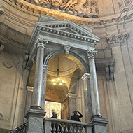 Elegant stone architecture, steps statues and a dome