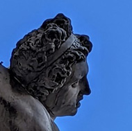 Statue of woman held aloft Florence, Italy