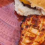 BBQ food spread over an outside table