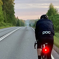 A man cycling on a road.