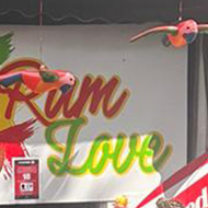 A very colourful stand and seller selling rum at the Notting Hill carnival.