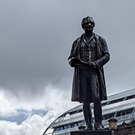 George Square in Glasgow. Statue of Robert Peel in the foreground and Glasgow City Chambers in background.