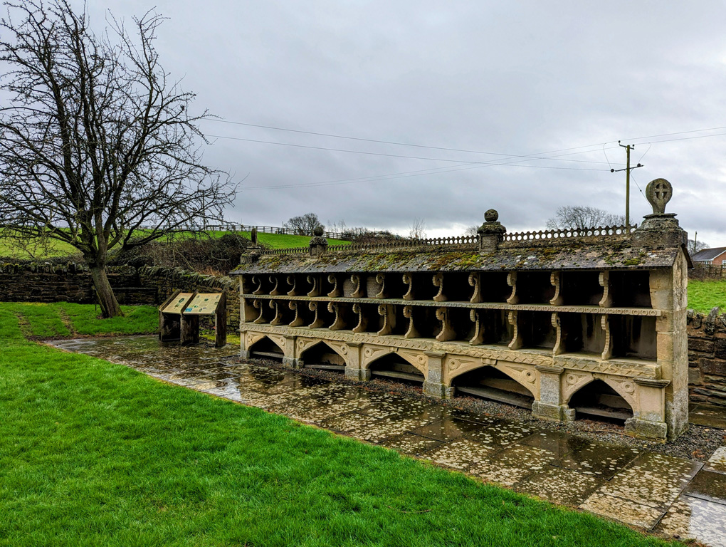 An ornate, stone bee shelter.