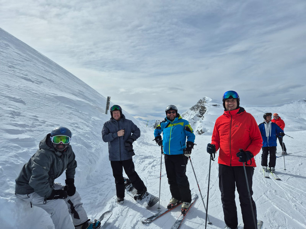 4 50 year olds skiing and snowboarding in Les Gets, French Alps