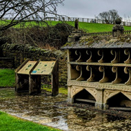 An ornate, stone bee shelter.