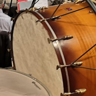 Four timpani and the orchestra rehearsing.