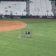 London Stadium redesigned to be a baseball diamond with baseball players warming up