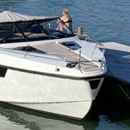 A jetty with a boat attached to it