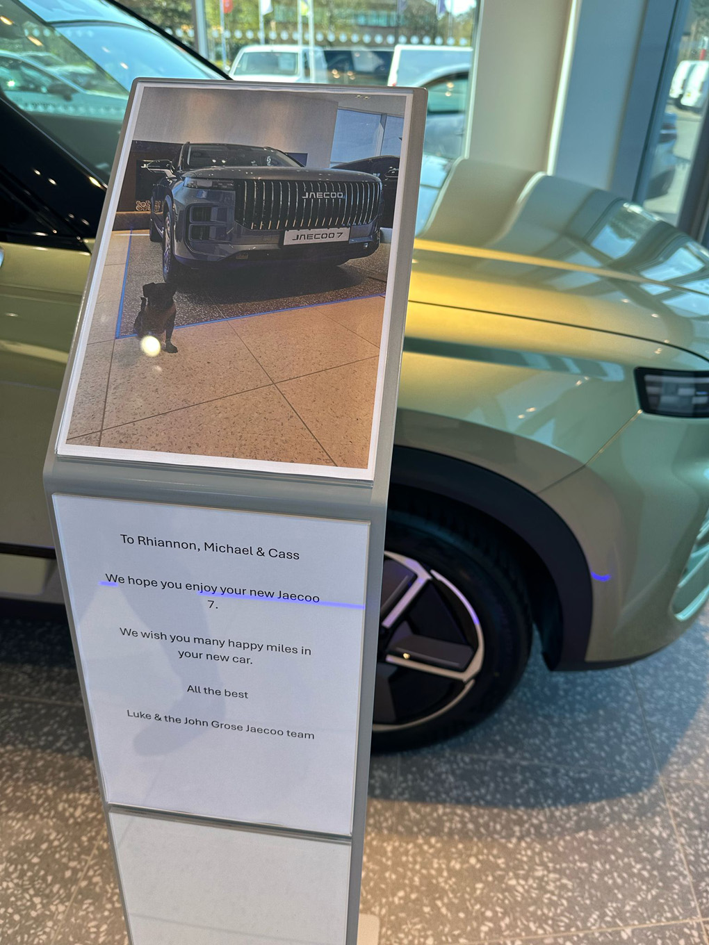 Dog in a picture of a car being sold