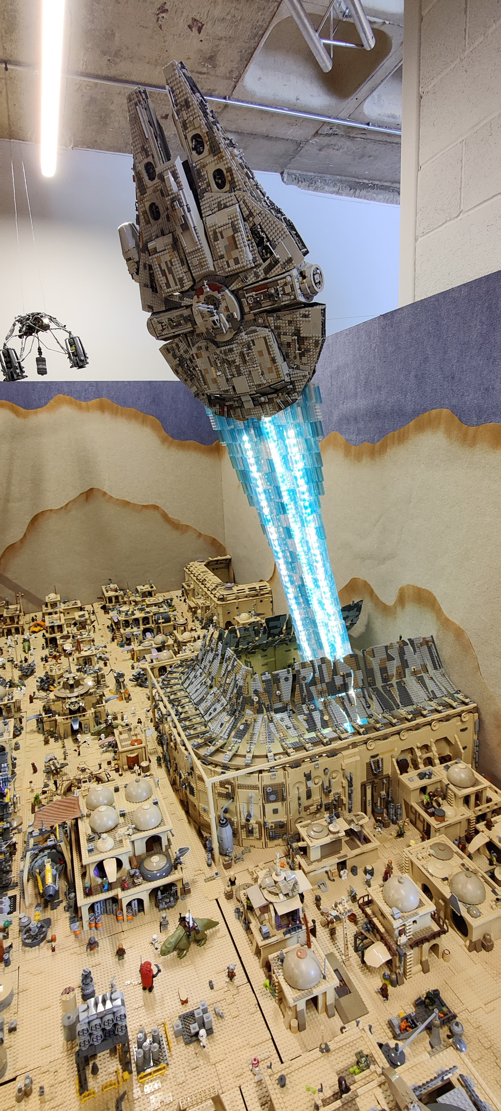 Lego build of Star Wars Mos Eisley space port with Millennium Falcon taking off
