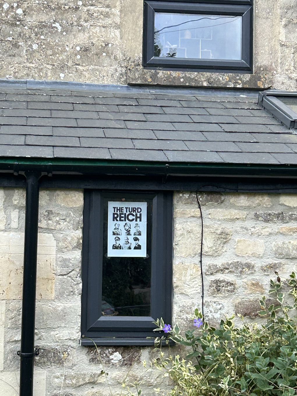 Poster in toilet window reading 
