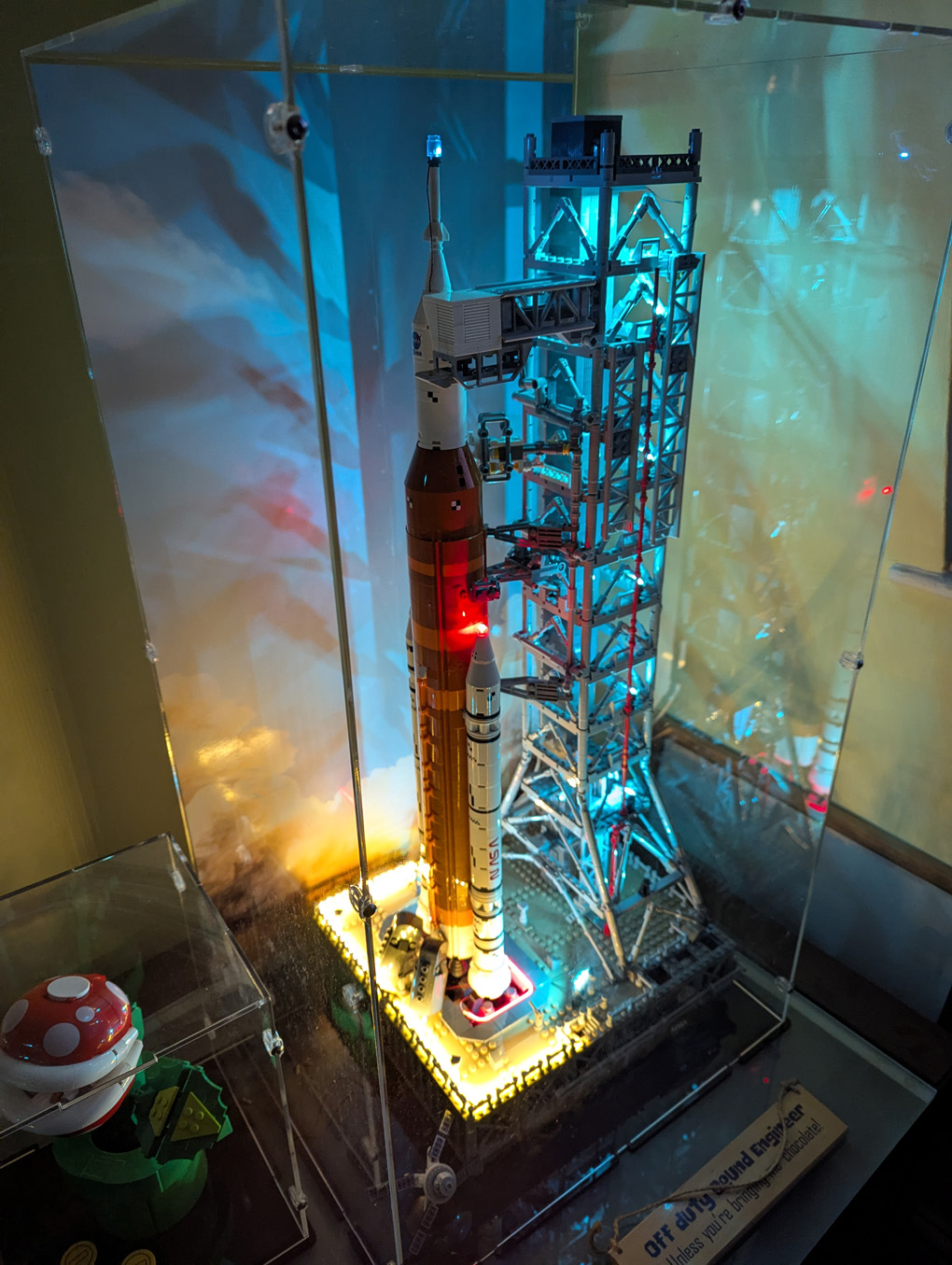 Lego space ship sitting on a launch platform covered in lights